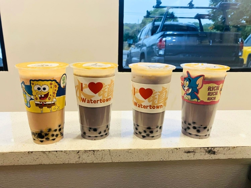 Boba tea drinks with cartoon-themed sleeves at Hoya Asian Express, a Chinese Restaurant in Watertown