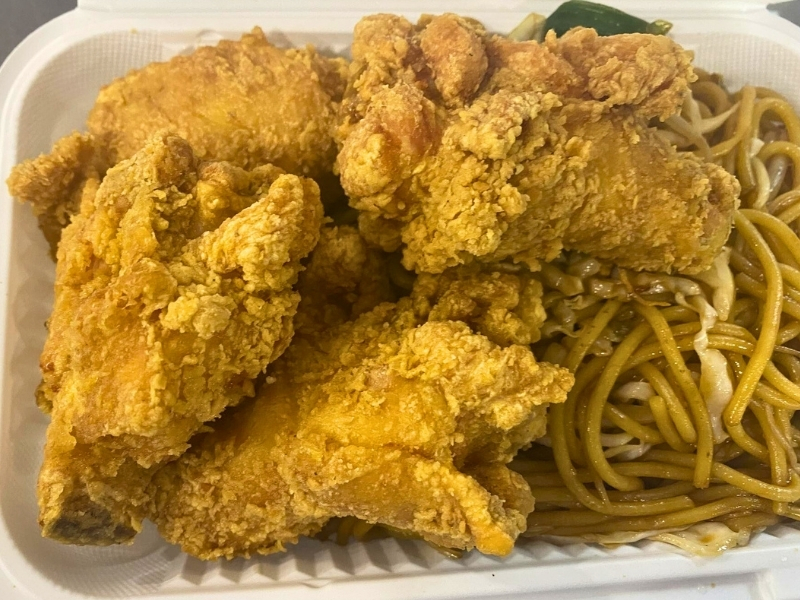 Crispy fried chicken served with yellow noodles at Hoya Asian Express, a Chinese Restaurant in Watertown