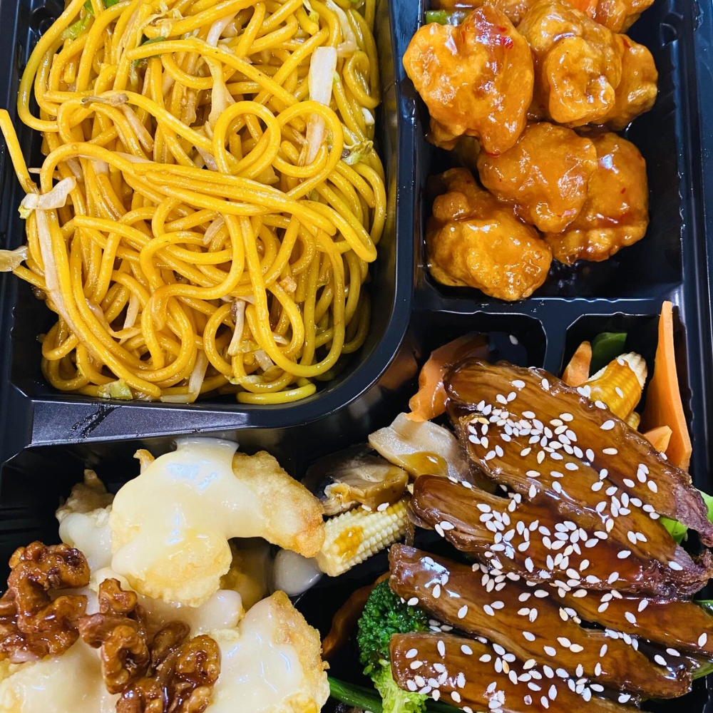 Mixed entrees with noodles, chicken and veggies at Hoya Asian Express, a Chinese Restaurant in Watertown