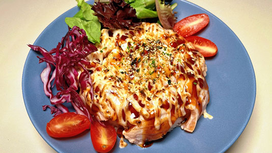 Savory rice dish with creamy sauce, tomatoes and greens at TOZZARELLA, a Dessert restaurant in College Point