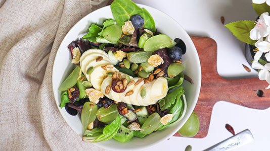 Fresh fruit salad with banana, grapes, greens and nuts at TOZZARELLA, a Dessert restaurant in College Point