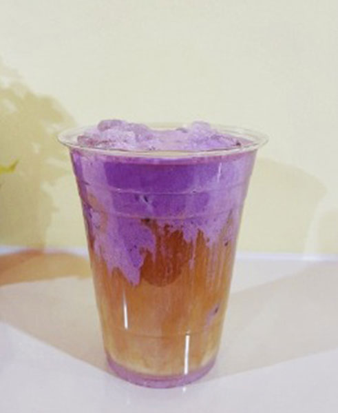 Purple and orange layered iced drink in a clear cup at TOZZARELLA, a Dessert restaurant in College Point