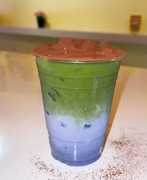 Green matcha and purple layered drink with cocoa topping at TOZZARELLA, a Dessert restaurant in College Point