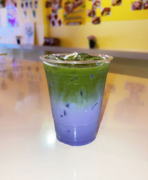 Iced matcha latte with blue and purple layers at TOZZARELLA, a Dessert restaurant in College Point