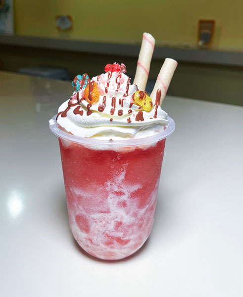 Pink whipped cream frappe with sprinkles and wafer sticks at TOZZARELLA, a Dessert restaurant in College Point