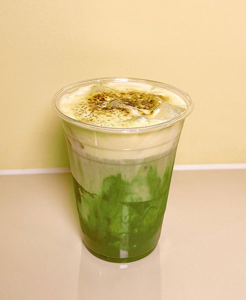 Green matcha latte with creamy foam topping at TOZZARELLA, a Dessert restaurant in College Point