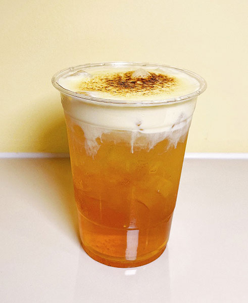 Golden iced tea with caramelized foam top at TOZZARELLA, a Dessert restaurant in College Point