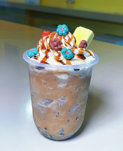 Chocolate milkshake with whipped cream and candy toppings at TOZZARELLA, a Dessert restaurant in College Point
