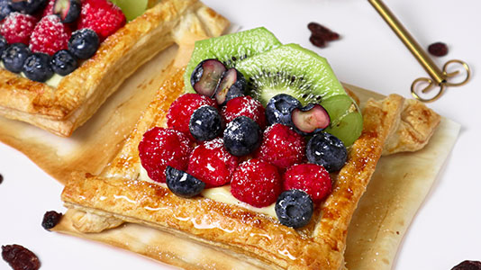 Fresh fruit puff pastries with berries and kiwi toppings at TOZZARELLA, a Dessert restaurant in College Point
