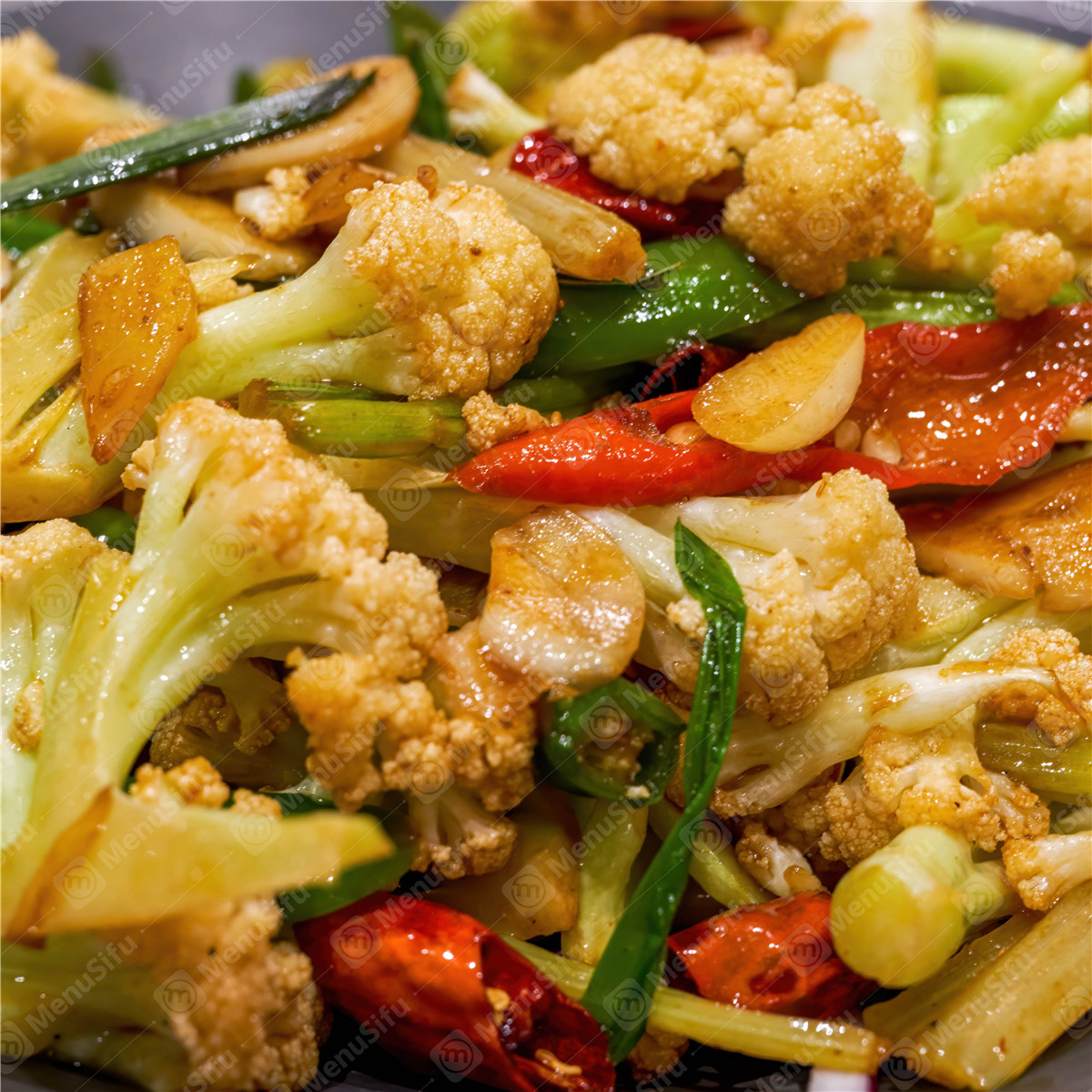 Stir-fried cauliflower with peppers and garlic