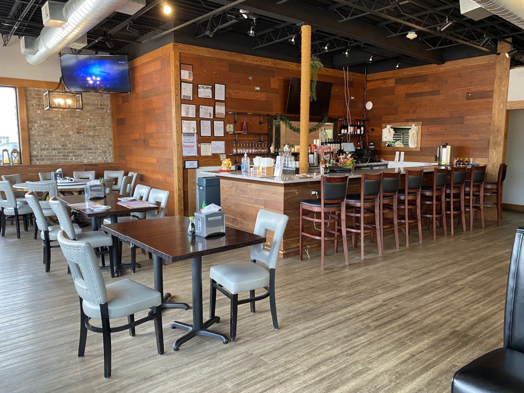 Bar counter and casual seating area inside HuNan Impression