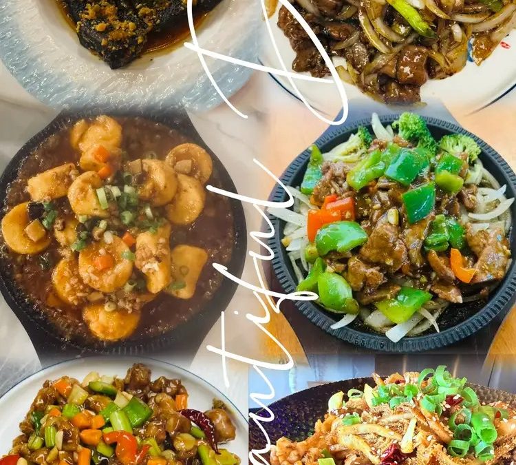 A selection of Hunan dishes including dry pot, stir-fried pork, and sizzling specialties at HuNan Impression