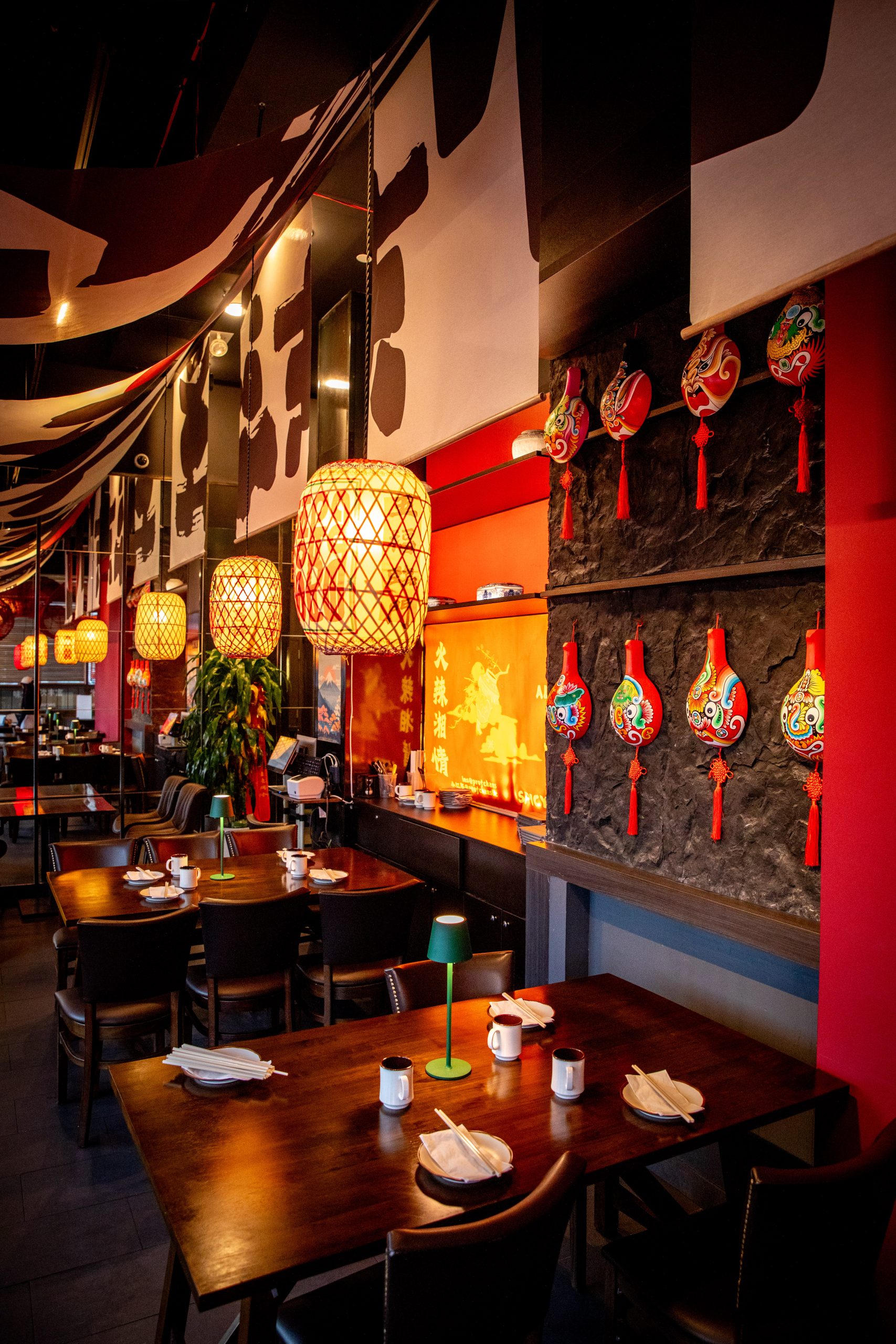 Decorative wall with Chinese masks at Hunan Tapas, an Hunan Restaurant in NY