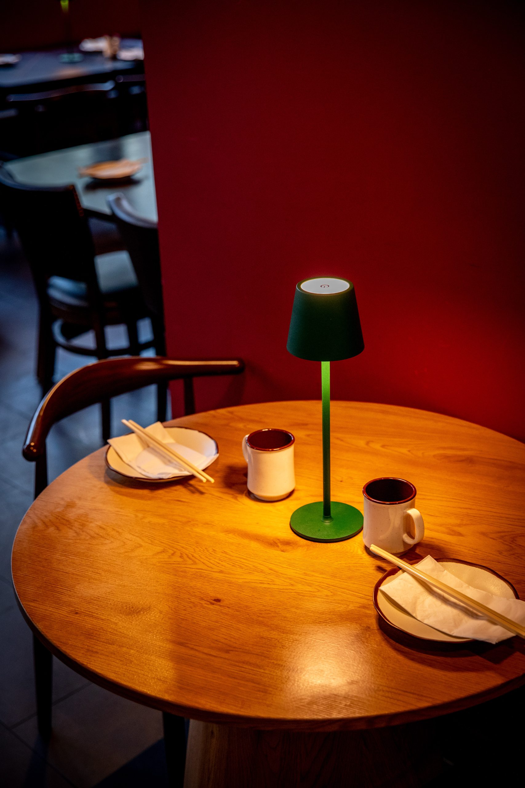 Round wooden table set with tableware at Hunan Tapas, an Hunan Restaurant in NY