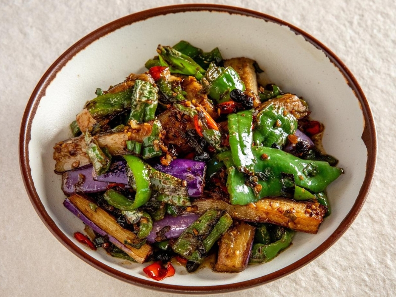 Stir-fried eggplant with green peppers and chilies at Hunan Tapas, an Hunan Restaurant in NY