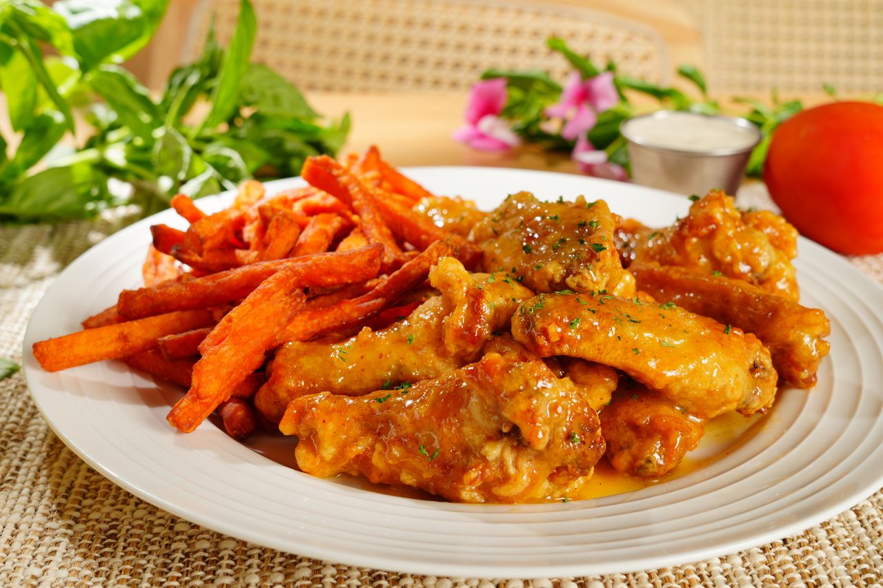 Buffalo Chicken Wings with Sweet Potato Fries at Hutto Seafood Wings Seafood Restaurant in Irmo, South Carolina