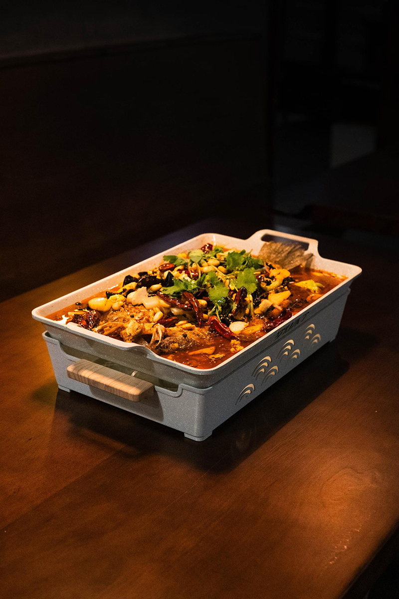 Spicy grilled fish in rectangular casserole at 梦幻冰季 - ICERA，a Asian Fusion BBQ Restaurant in New York