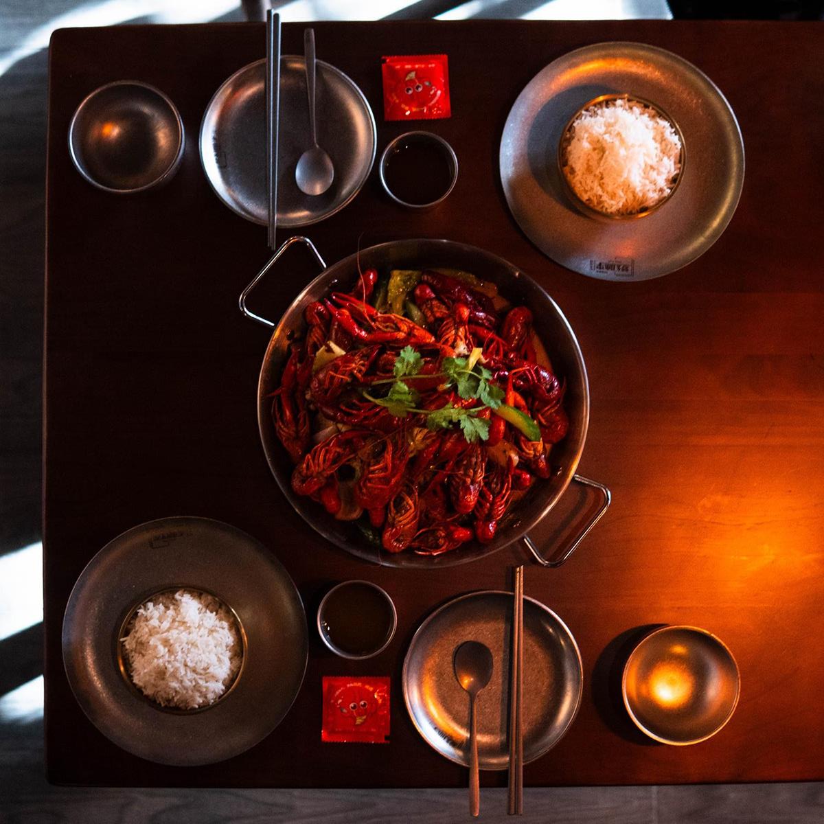 Spicy crawfish pot with rice bowls at 梦幻冰季 - ICERA，a Asian Fusion BBQ Restaurant in New York