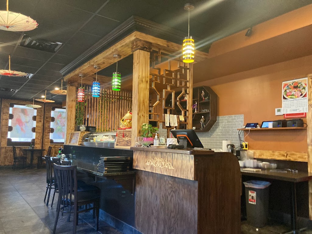 Wooden restaurant front counter with colorful pendant lights and traditional decor at Ichiban Sushi, a Japanese Restaurant in Cuyahoga Falls