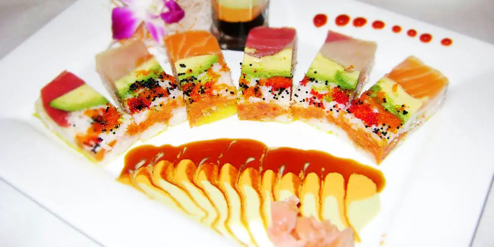 Artistic sushi platter with layered fish and avocado at Ichiban, a Japanese Restaurant in Sheffield