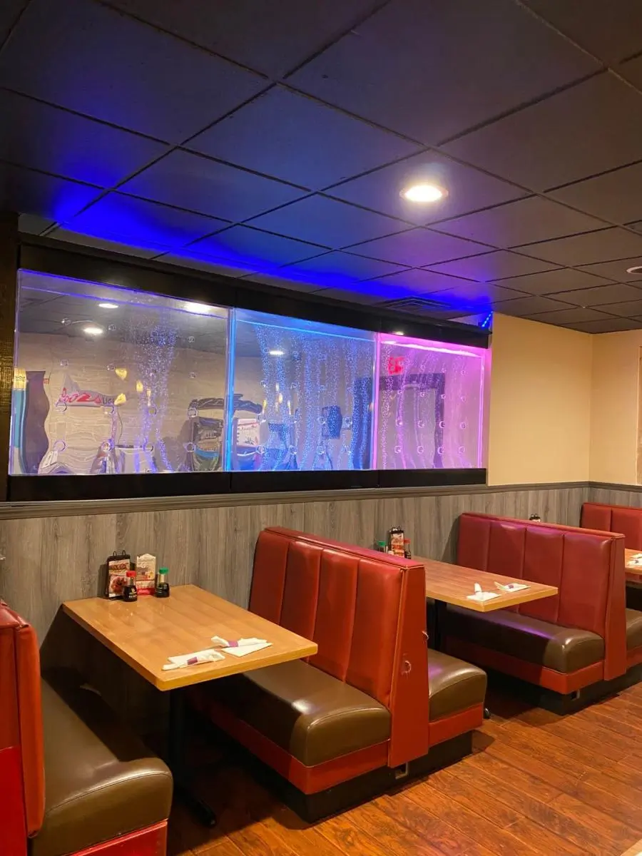 Booth seating area with colorful LED water walls at Ichiban, a Japanese Restaurant in Sheffield