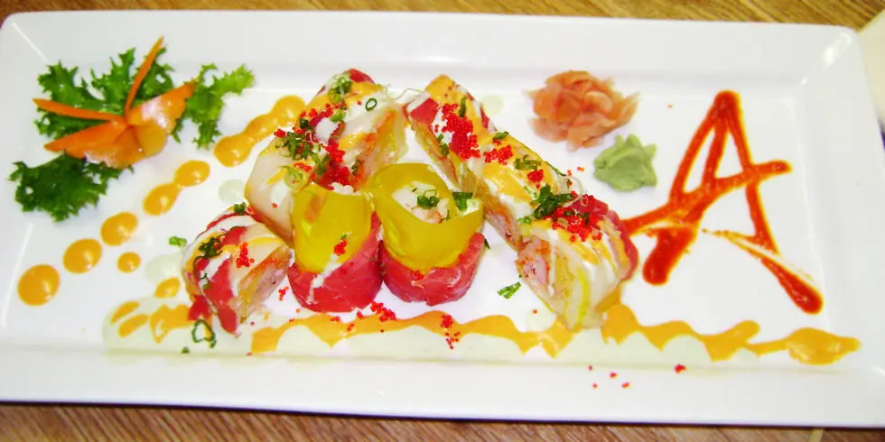 Colorful sushi roll with tuna, tobiko and sauces at Ichiban, a Japanese Restaurant in Sheffield