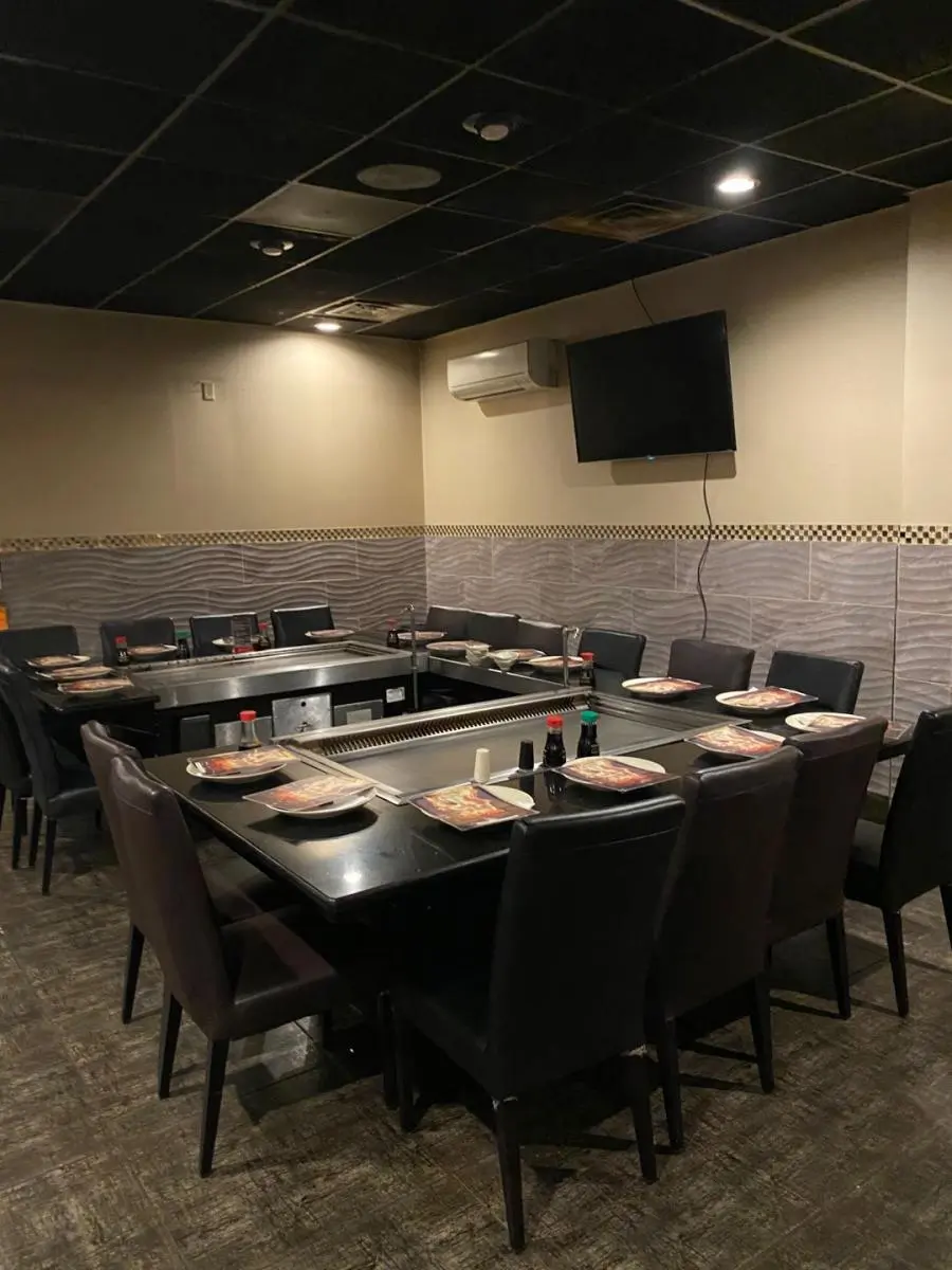 Hibachi tables set with plates and condiments at Ichiban, a Japanese Restaurant in Sheffield