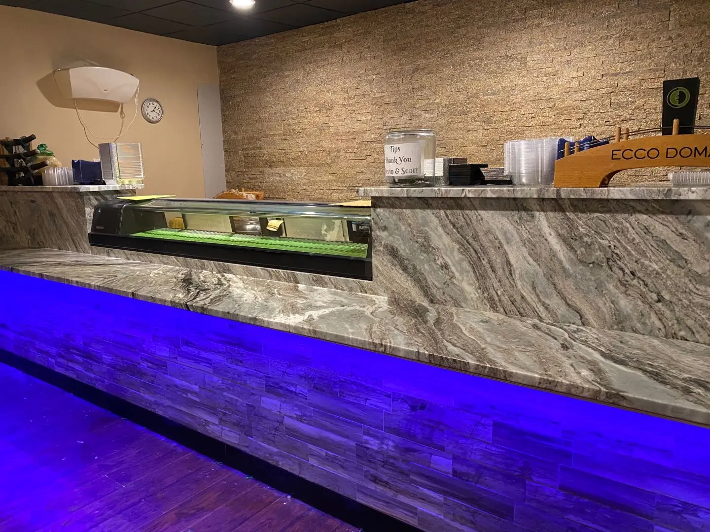 Modern sushi bar with marble counter and blue LED lighting at Ichiban, a Japanese Restaurant in Sheffield