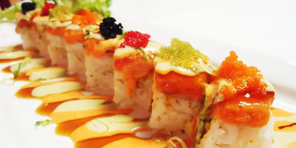Sushi roll topped with multi-colored tobiko and creamy sauce at Ichiban, a Japanese Restaurant in Sheffield