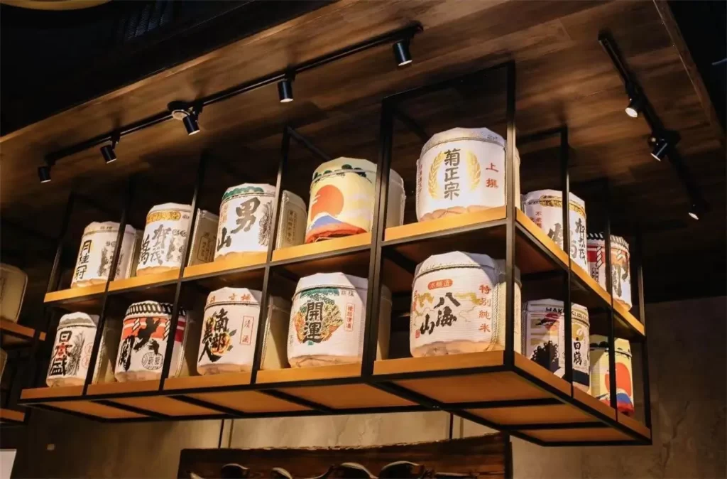 Decorative Japanese sake barrels mounted on wall racks at Ichiban Japanese Steakhouse & Sushi Bar, a Japanese Restaurant in Waco