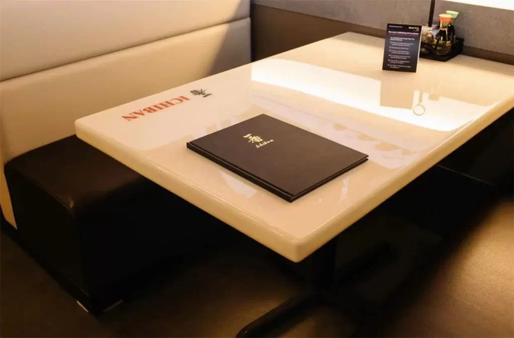 Glossy dining table with branded menu booklet at Ichiban Japanese Steakhouse & Sushi Bar, a Japanese Restaurant in Waco