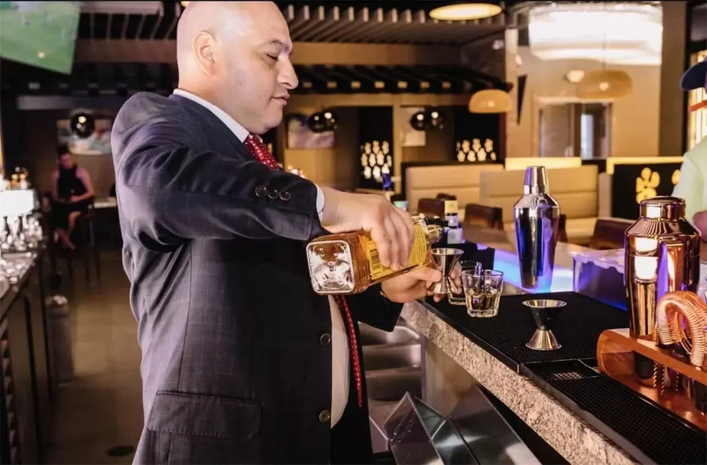 Professional bartender pouring liquor to mix craft drinks at Ichiban Japanese Steakhouse & Sushi Bar, a Japanese Restaurant in Waco