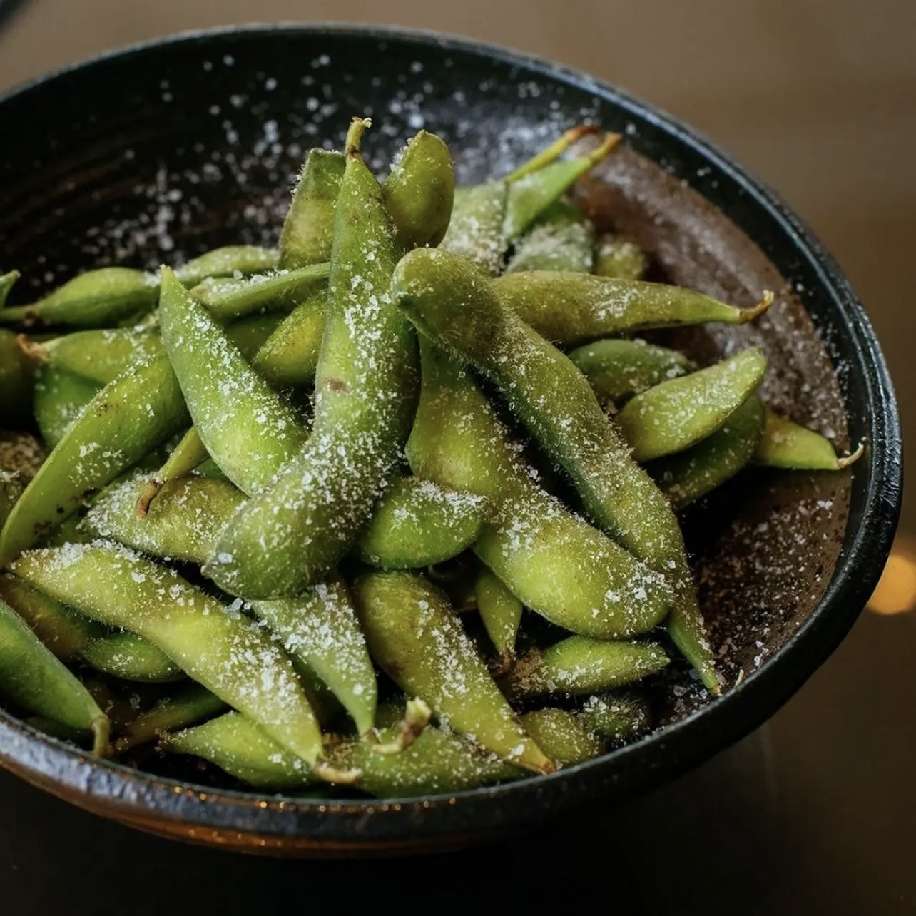 Salted Edamame - Boiled edamame sprinkled with salt, a classic Japanese appetizer at Ichiddo Ramen Rochester, a Japanese Restaurant in Rochester