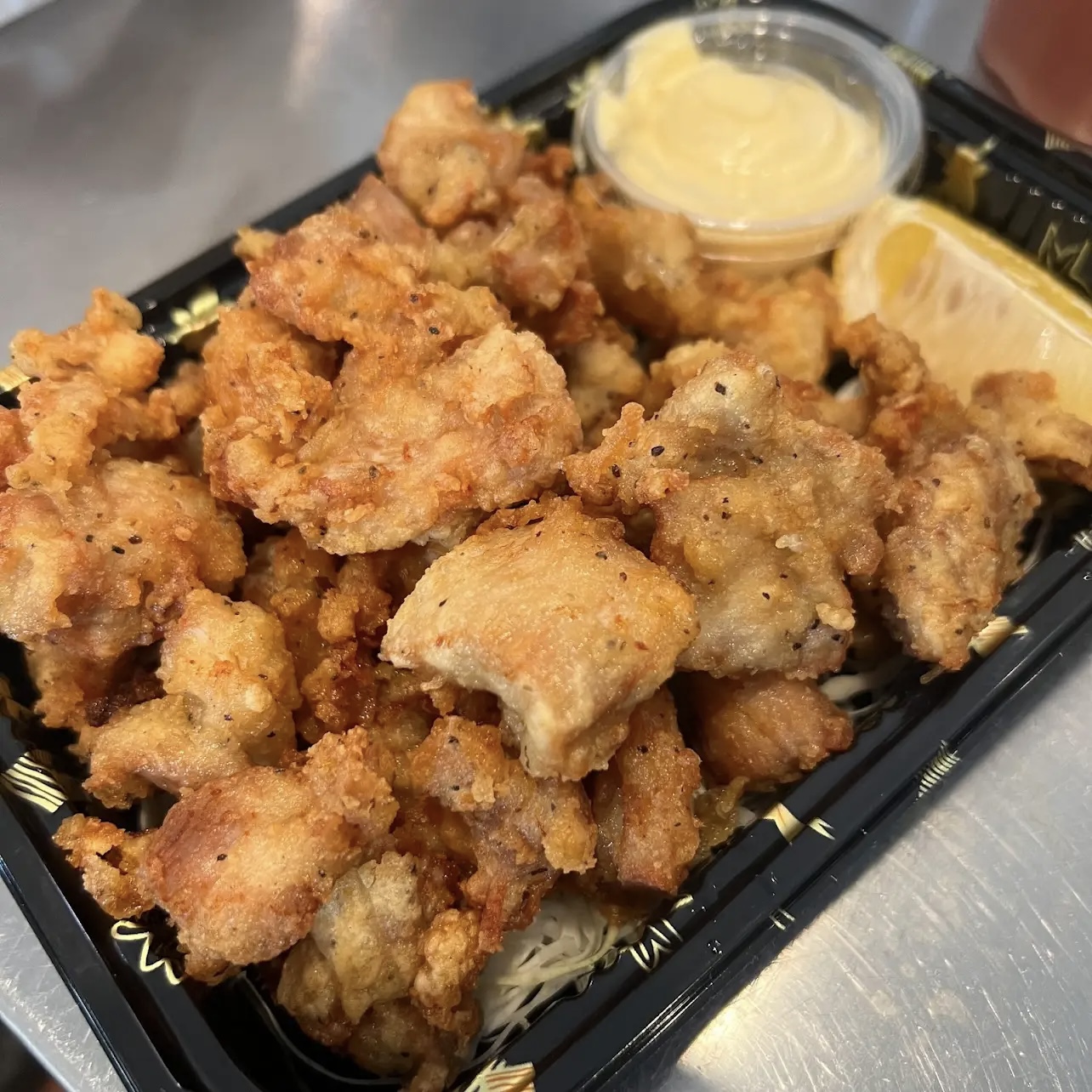 Karaage Chicken - Crispy fried chicken pieces served with lemon and mayo at Ichiddo Ramen Rochester, a Japanese Restaurant in Rochester