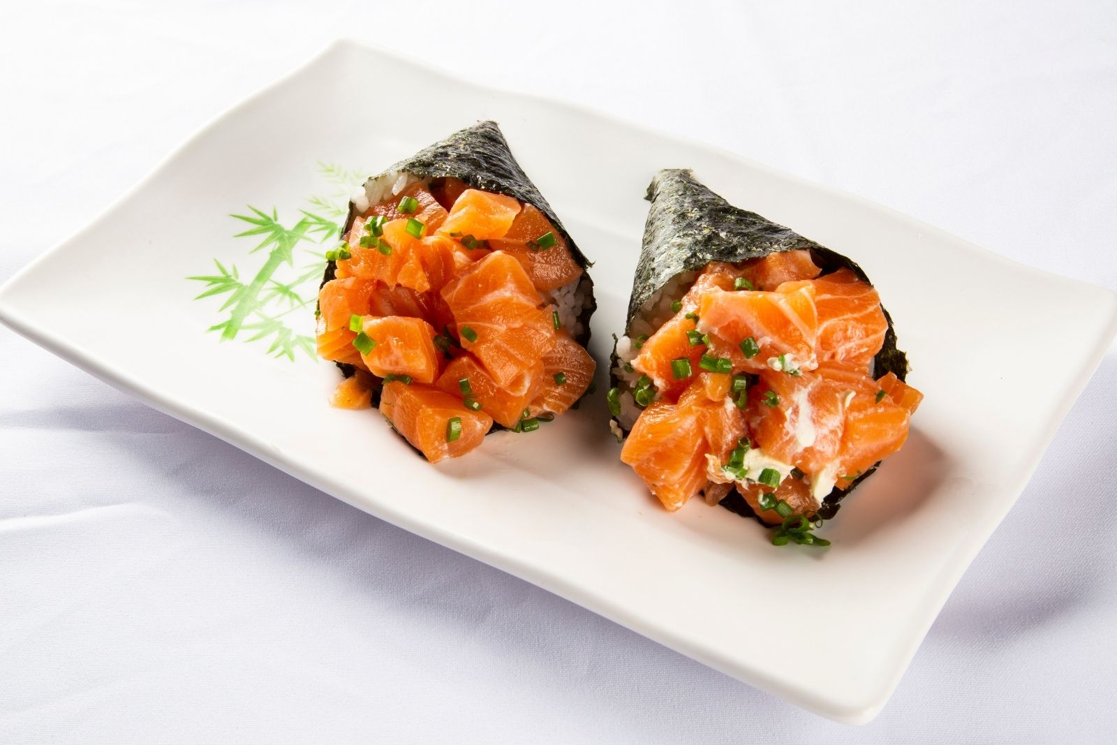 Fresh salmon hand roll with chives at Iki Sekai Omakase, a Japanese Restaurant in New York