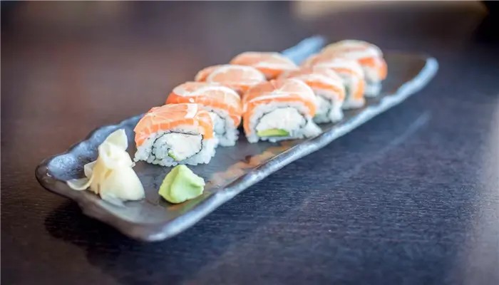 Salmon sushi roll with avocado, ginger and wasabi at Ikoi Sushi，a Sushi Restaurant in San Rafael