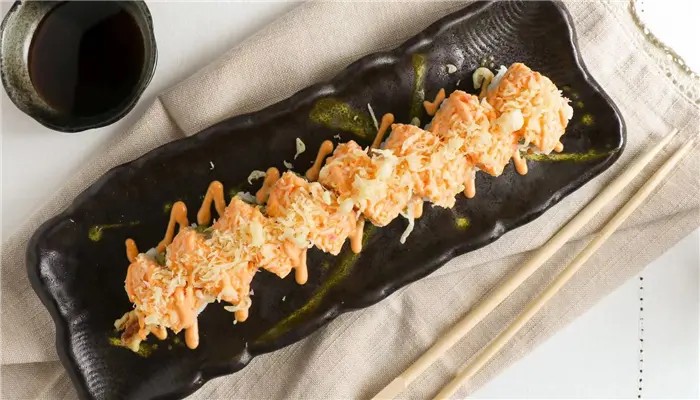 Special crab sushi roll drizzled with spicy sauce at Ikoi Sushi，a Sushi Restaurant in San Rafael