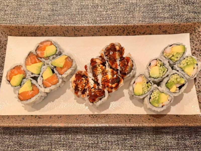 Ikyu-Sushi-II-Japanese-Restaurant-Maki-B-Combo-Roll-New-York Three types of maki rolls on a plate at Ikyu Sushi II, a Japanese Restaurant in New York.