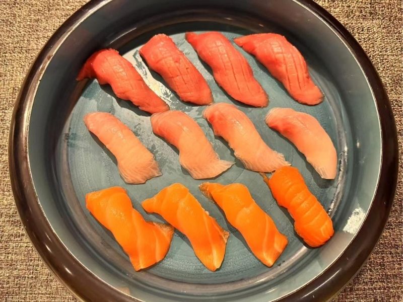 Plate of premium tri - color sushi at Ikyu Sushi II, a Japanese Restaurant in New York.