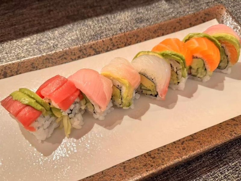 Ikyu-Sushi-II-Japanese-Restaurant-Rainbow-Roll-New-York Rainbow roll sushi on a plate at Ikyu Sushi II, a Japanese Restaurant in New York.