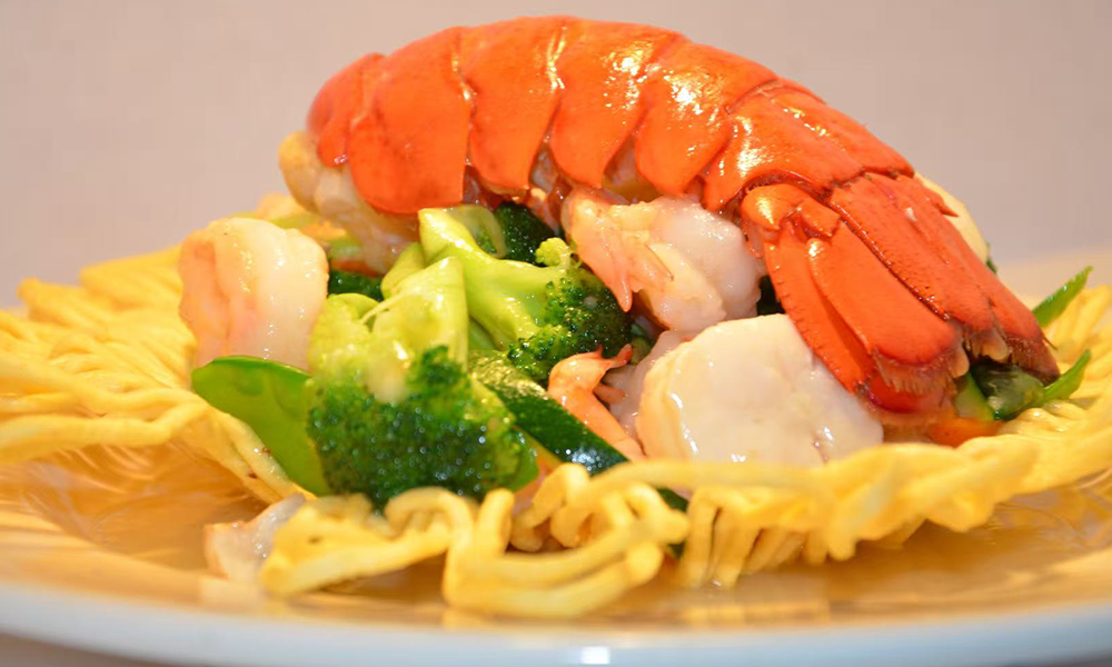 Lobster and seafood served on crispy noodles with veggies, a luxurious dish at Imperial Dynasty, a Chinese Restaurant in Cranston