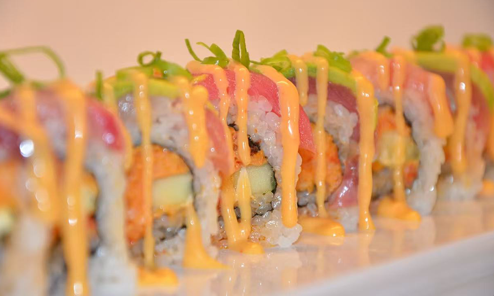 Tuna and avocado sushi roll drizzled with spicy sauce, a tasty sushi option at Imperial Dynasty, a Chinese Restaurant in Cranston