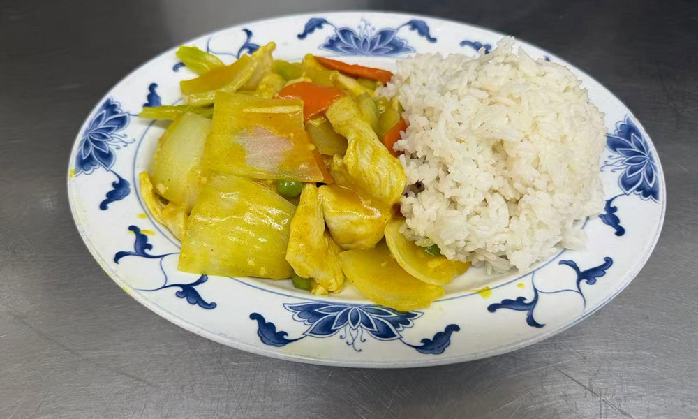 Curry chicken stir-fry with vegetables served with steamed rice at Imperial Garden, a Chinese Restaurant in Philadelphia