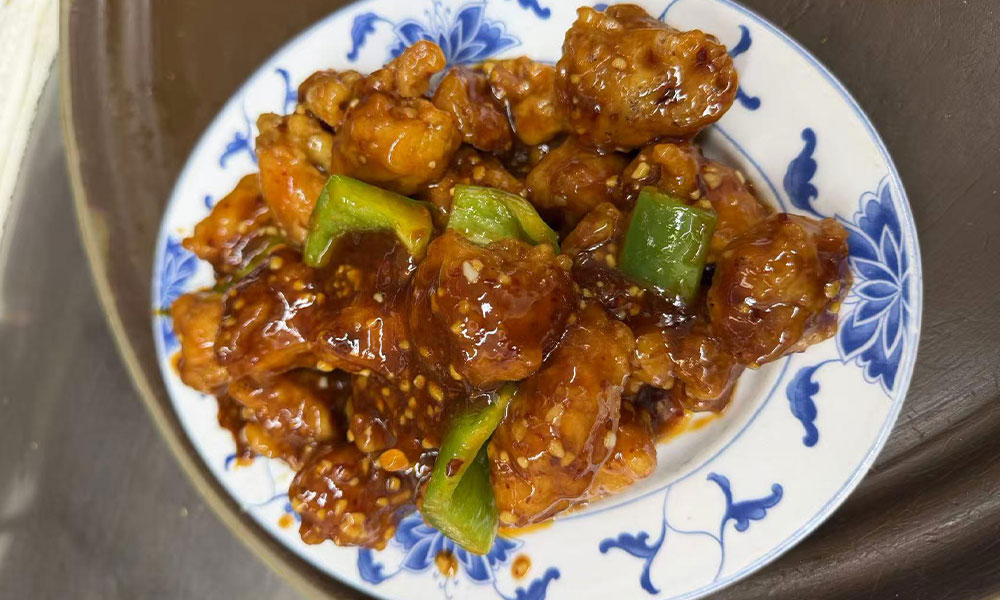 Sesame chicken stir-fry with bell peppers in a savory brown sauce at Imperial Garden, a Chinese Restaurant in Philadelphia