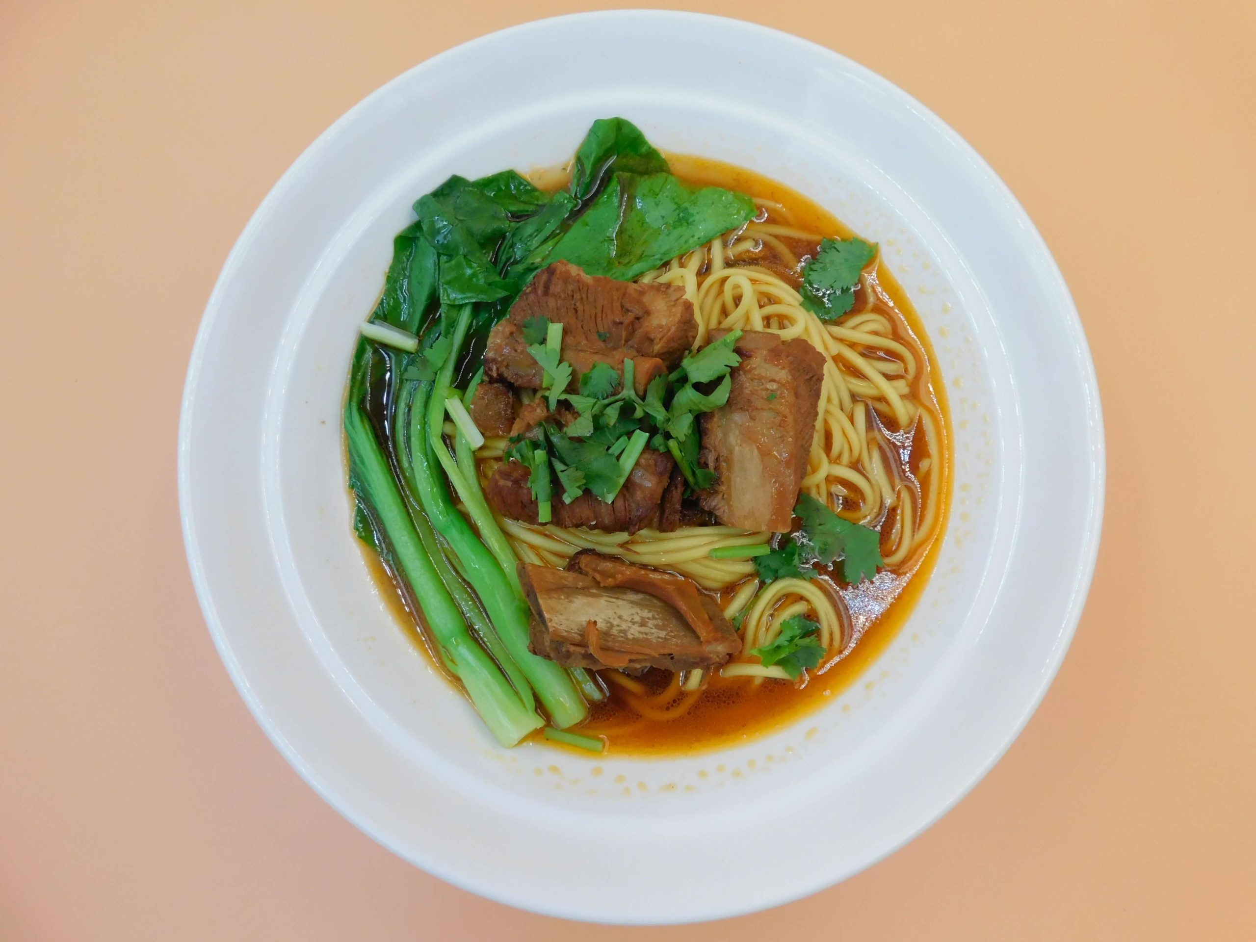 Braised pork rib noodle soup with tender ribs and greens at Okinii Japanese Restaurant & Impressive Noodle, a Asian Fusion Restaurant in Massapequa
