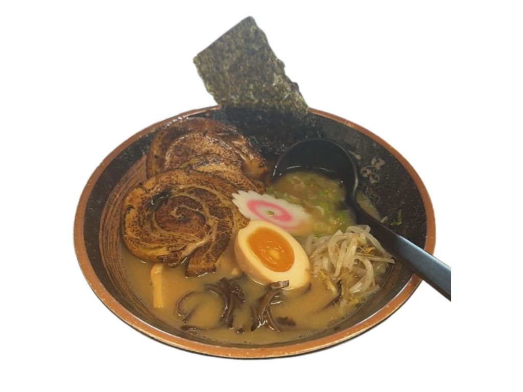 Chashu ramen with tender pork, soft - boiled egg, and assorted toppings at Ippin Ramen & Sushi Bar, a Japanese Restaurant in Mankato