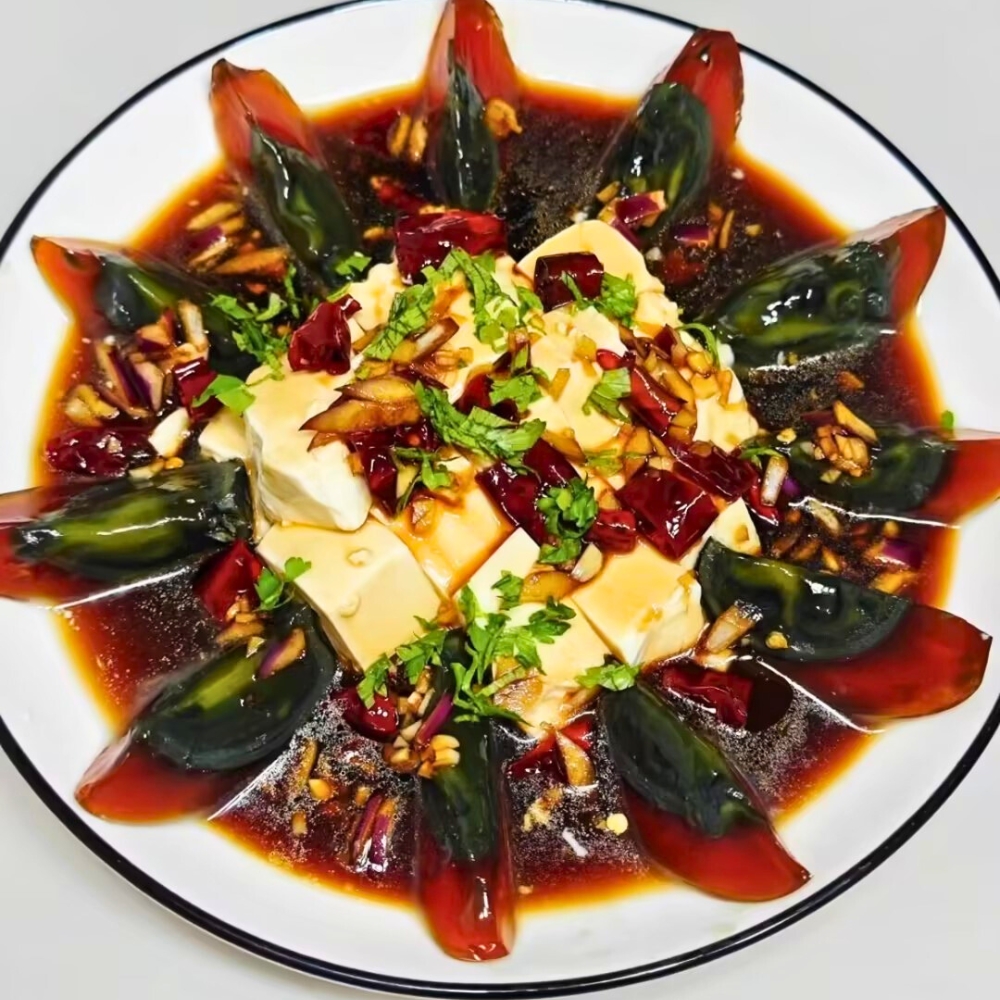 Chilled tofu with century eggs, topped with spicy garlic sauce at Iron Pot Stew Kitchen, a Chinese Restaurant in Santa Clara