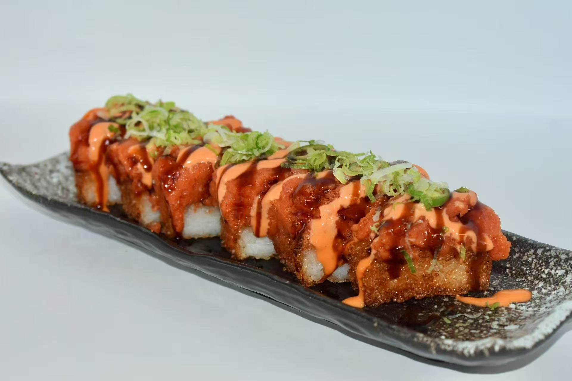 Crispy rice with toppings and sauces at Isohama,a Japanese Restaurant in New York.