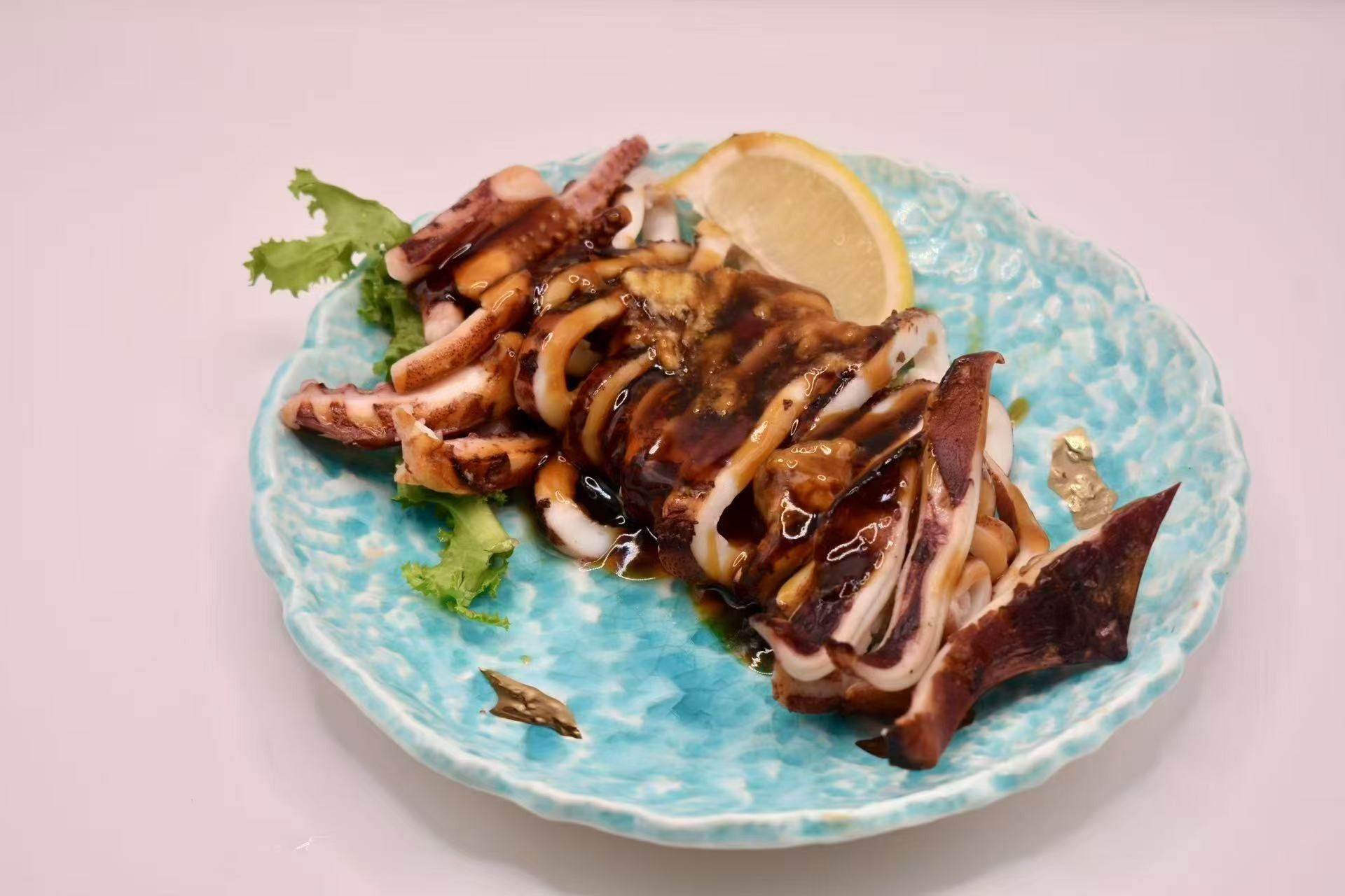 Grilled squid with savory sauce at Isohama,a Japanese Restaurant in New York.