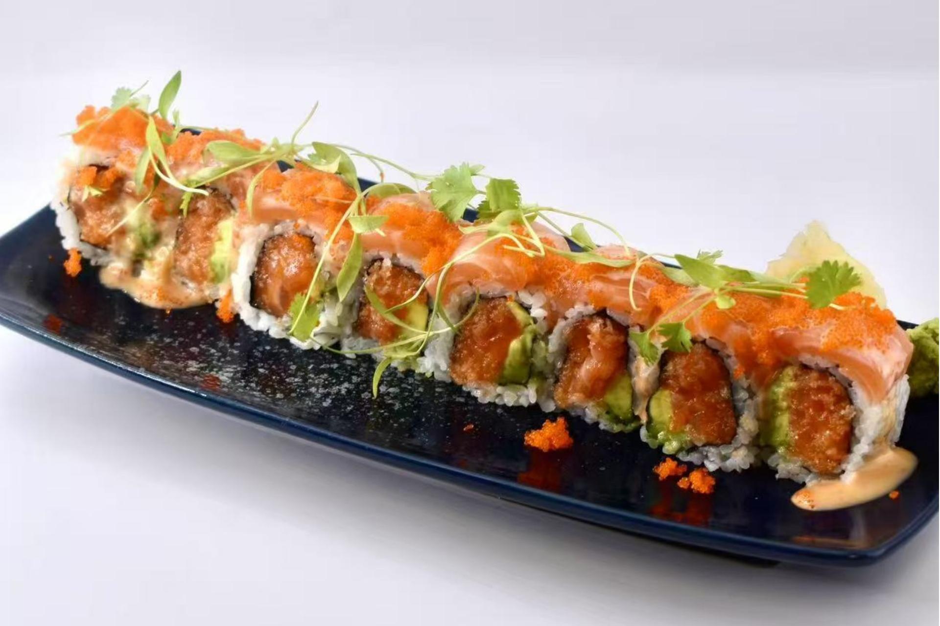 Salmon roll with toppings and greens at Isohama,a Japanese Restaurant in New York.